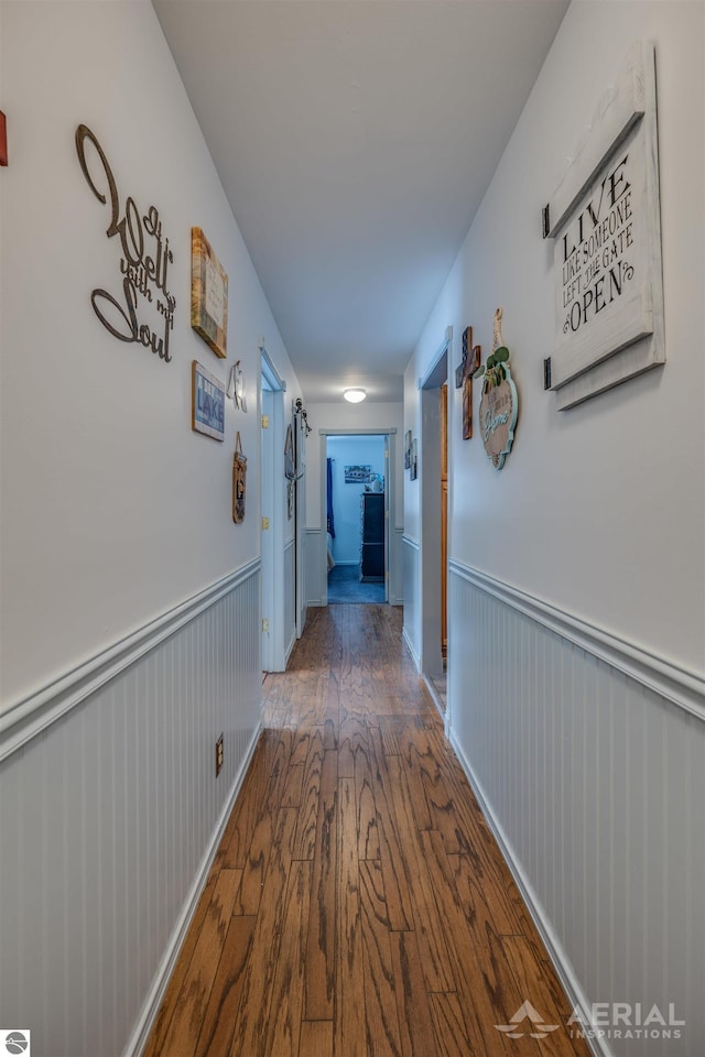 corridor with dark wood-type flooring