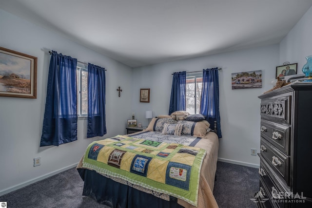 bedroom with dark colored carpet