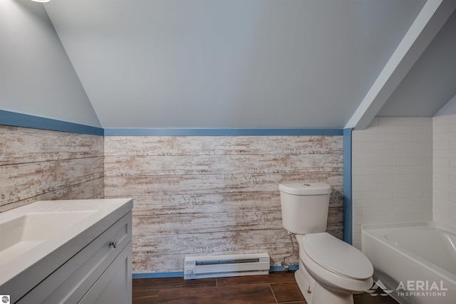 bathroom featuring vanity, lofted ceiling, a bathing tub, toilet, and a baseboard radiator