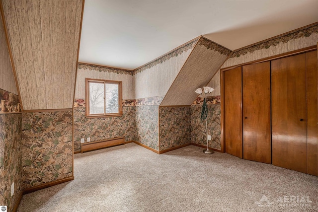 bonus room featuring baseboard heating and light colored carpet