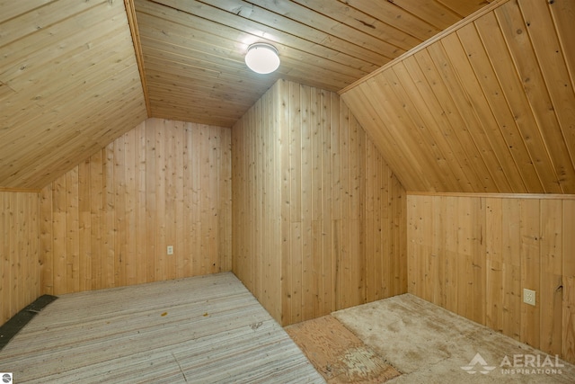 bonus room featuring wood ceiling, vaulted ceiling, and wood walls