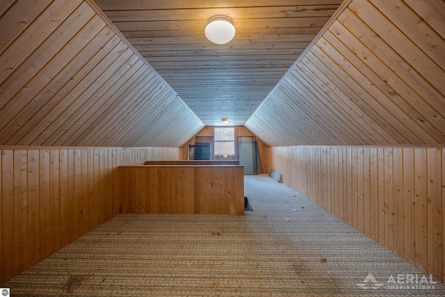 bonus room with carpet, vaulted ceiling, wooden ceiling, and wooden walls