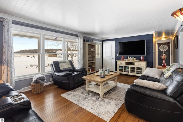 living room featuring dark hardwood / wood-style floors and ornamental molding