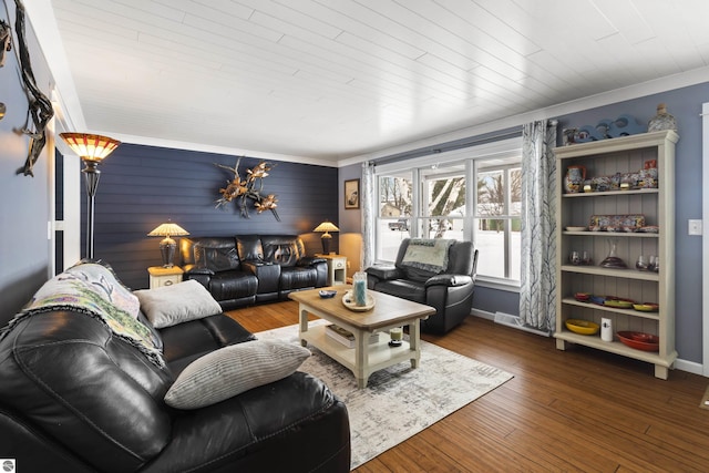 living room featuring wooden ceiling, dark hardwood / wood-style flooring, and crown molding