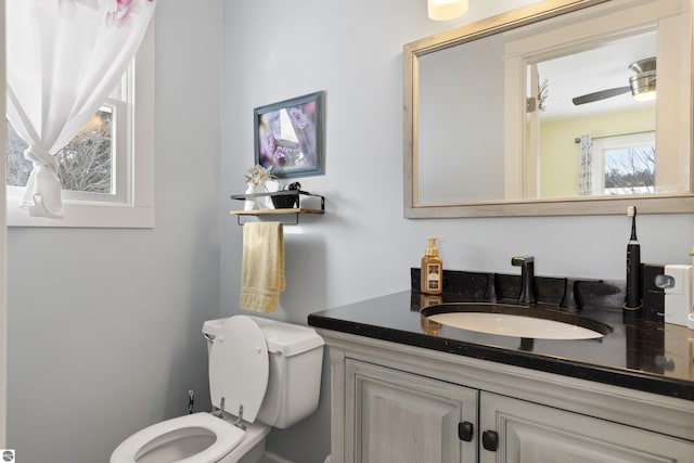 bathroom with toilet and vanity