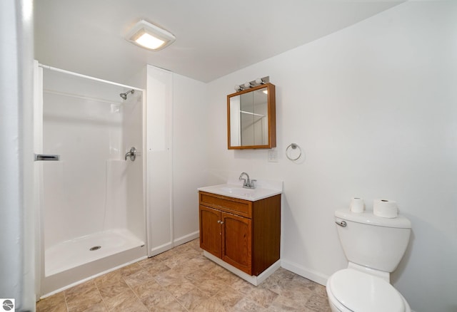 bathroom featuring a shower, toilet, and vanity