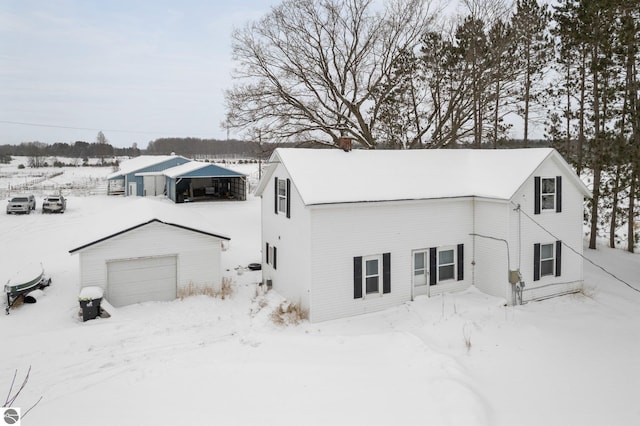 view of front of house with an outbuilding and a garage