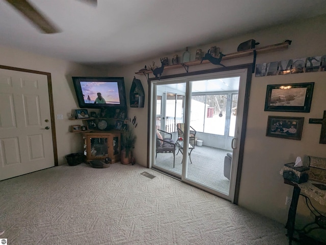living room featuring light colored carpet
