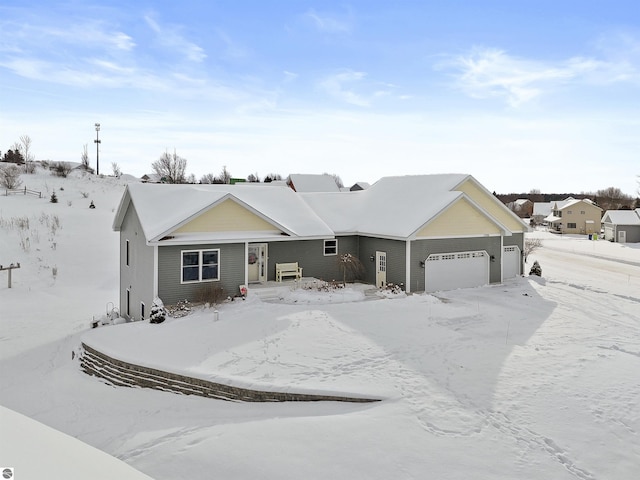 ranch-style home featuring a garage