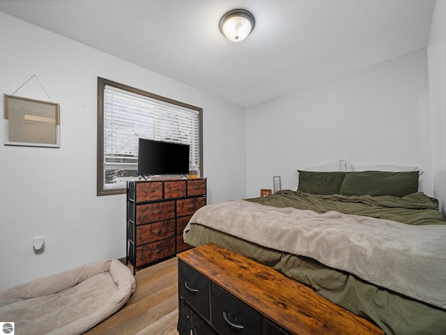 bedroom with light wood-type flooring