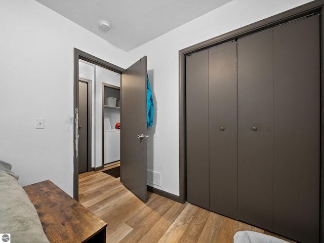 bedroom featuring a closet and light hardwood / wood-style floors