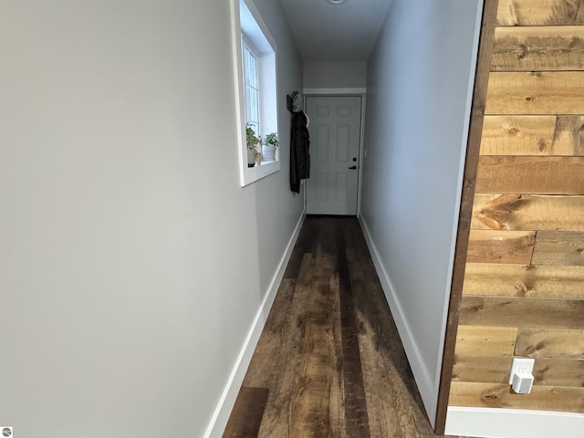 hall with dark wood-type flooring