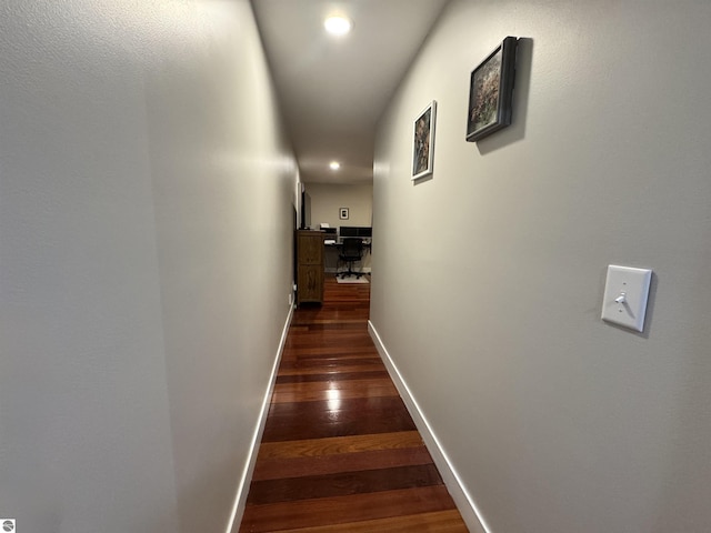 hallway with dark hardwood / wood-style floors