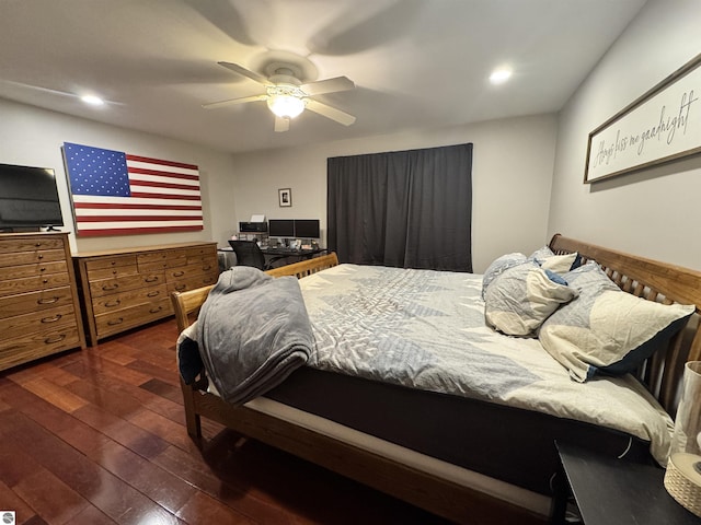 bedroom with ceiling fan and dark hardwood / wood-style flooring