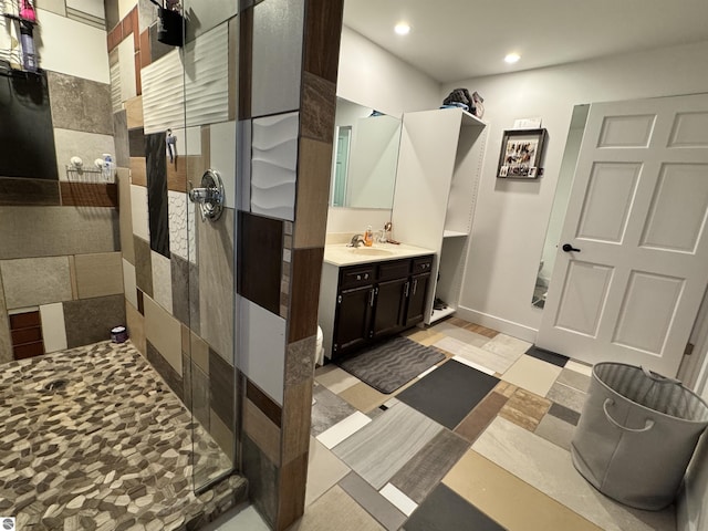 bathroom featuring vanity and a shower