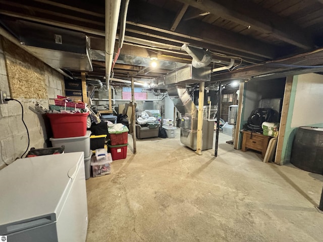 basement featuring fridge