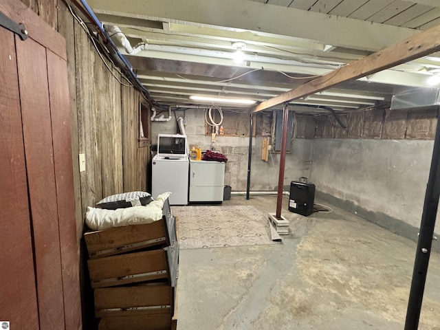 basement featuring washing machine and clothes dryer