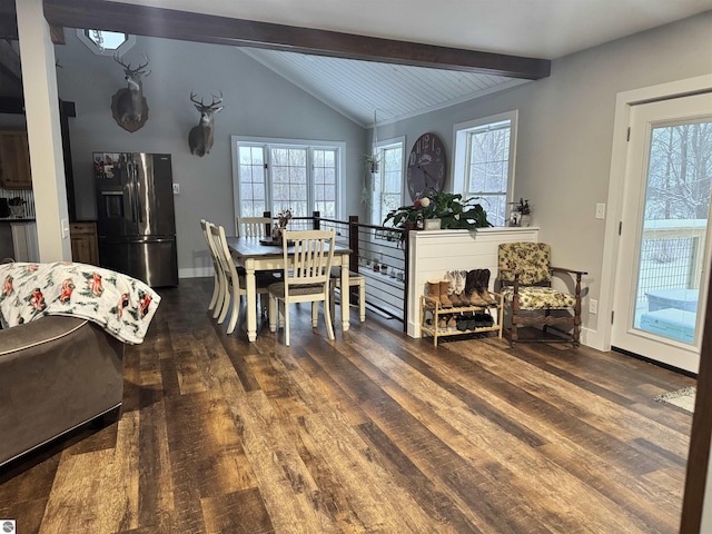 dining space featuring dark wood-type flooring, a healthy amount of sunlight, and lofted ceiling with beams