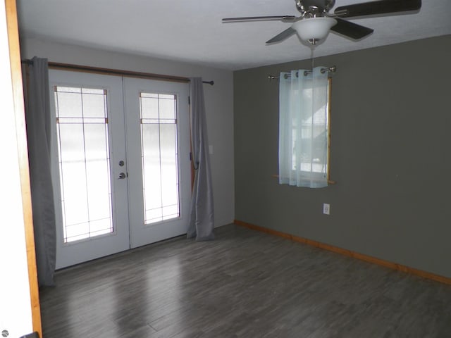 spare room featuring ceiling fan, dark hardwood / wood-style floors, and french doors