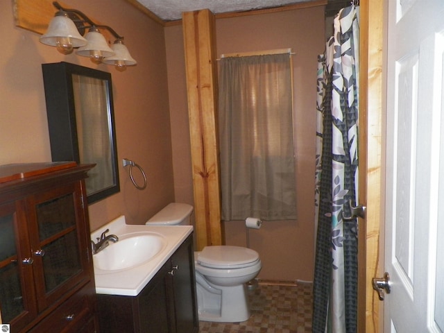 bathroom featuring toilet, vanity, and walk in shower