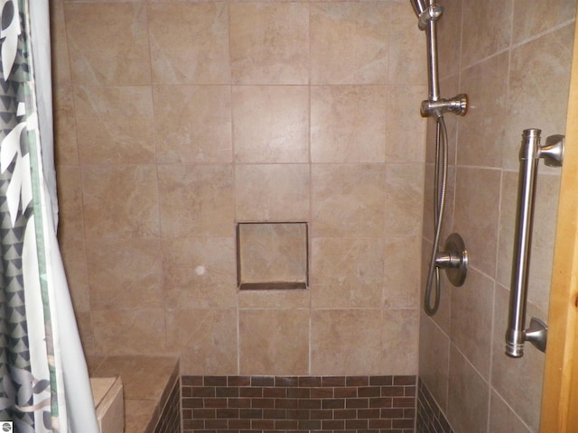 bathroom featuring a shower with curtain