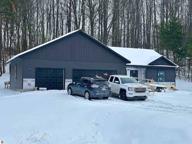 view of snow covered garage