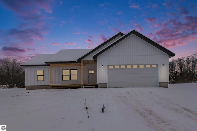 modern inspired farmhouse with an attached garage