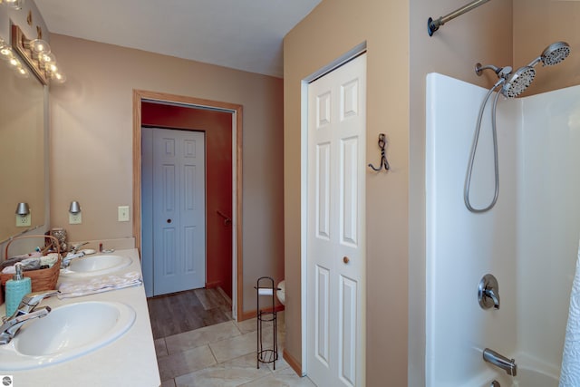 bathroom featuring shower / tub combination, tile patterned flooring, and vanity