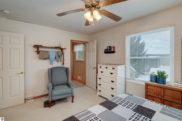 bedroom featuring ceiling fan and light carpet