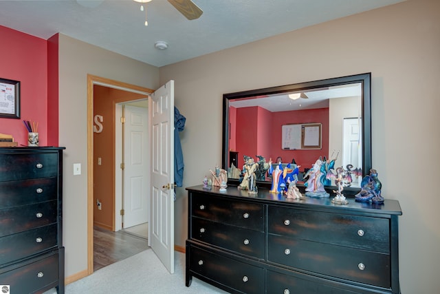 bedroom featuring light carpet and ceiling fan