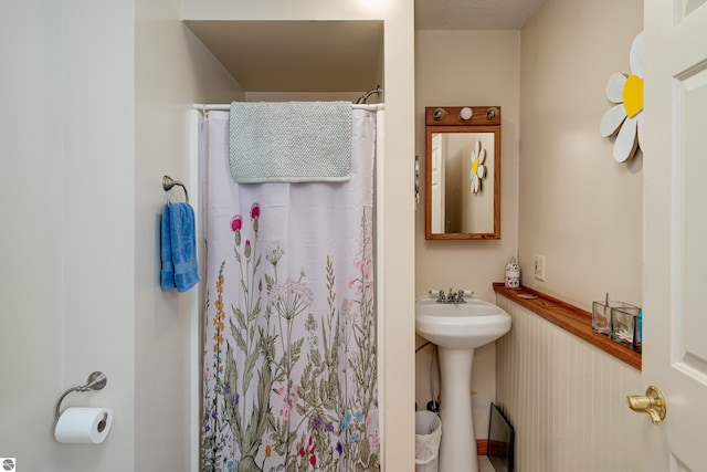 bathroom featuring sink and walk in shower