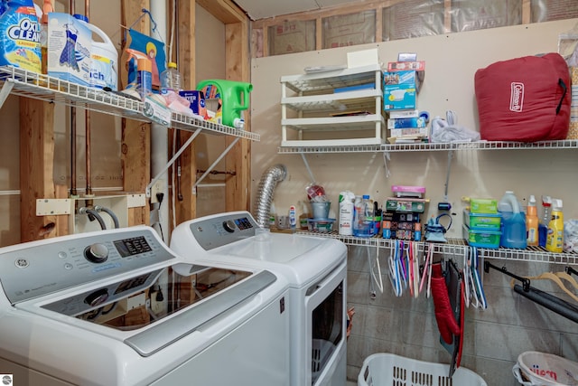 clothes washing area with independent washer and dryer