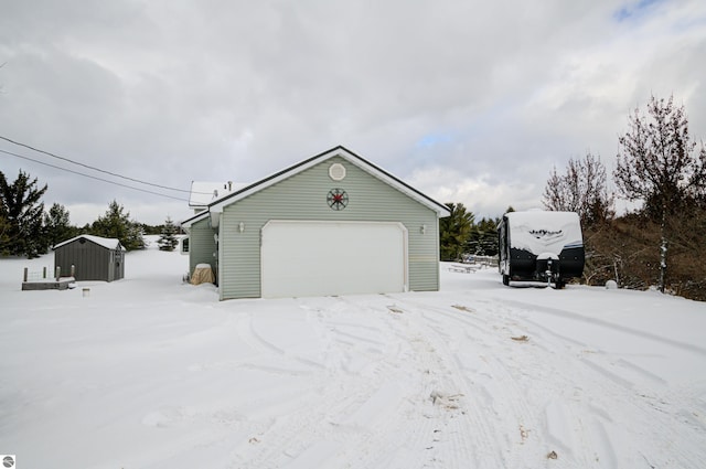 view of snow covered garage