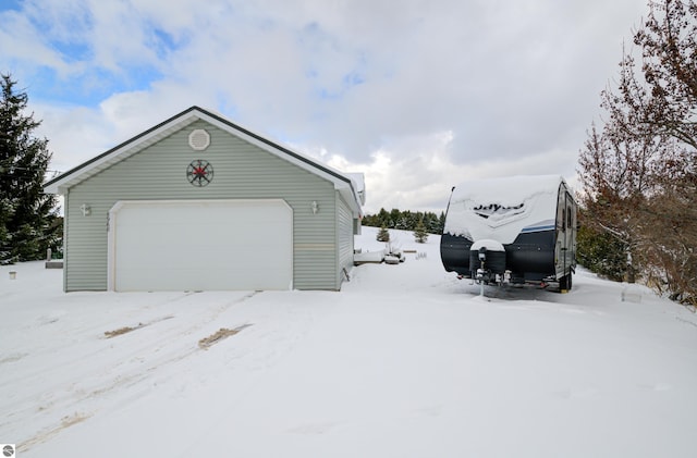 view of snow covered garage