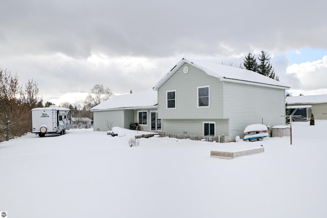 view of snow covered house