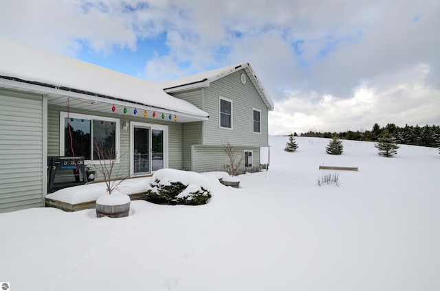 view of snow covered house