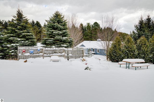 view of yard layered in snow