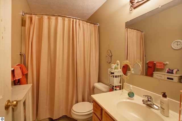 bathroom featuring a textured ceiling, toilet, a shower with curtain, and vanity