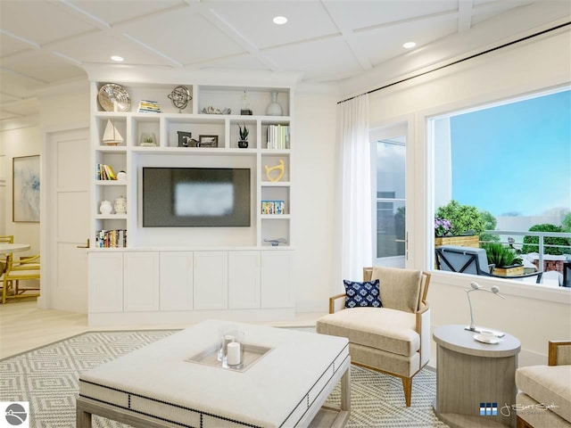 living room with built in features, coffered ceiling, and light hardwood / wood-style flooring