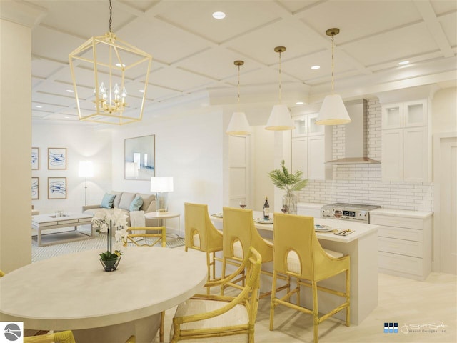 dining space featuring coffered ceiling and a notable chandelier