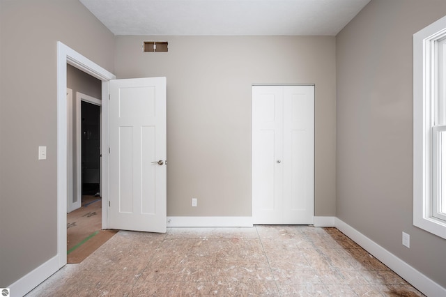 unfurnished bedroom featuring a closet