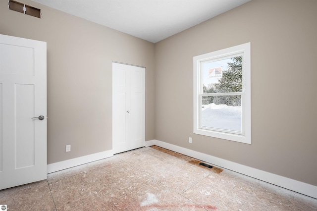 unfurnished bedroom with a closet