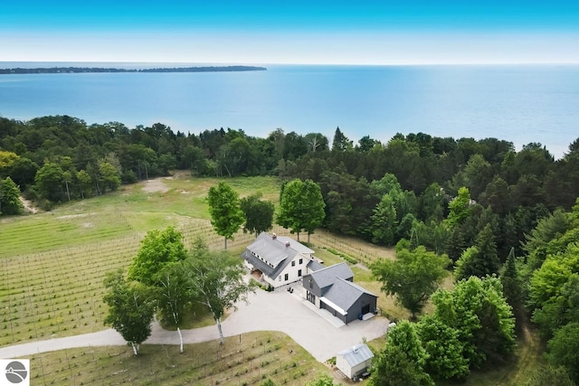 birds eye view of property featuring a rural view and a water view