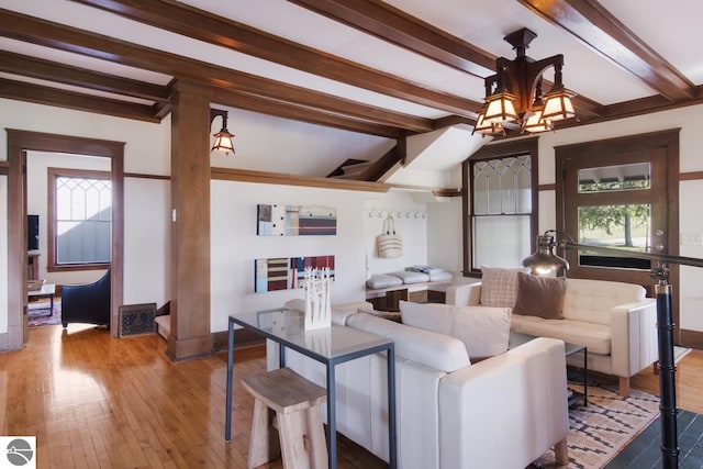 living room with hardwood / wood-style flooring and beam ceiling