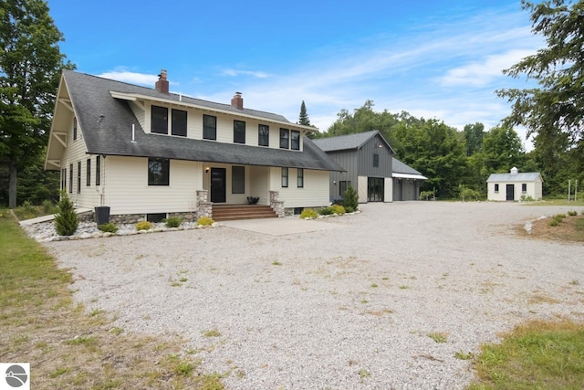 view of front of property with an outbuilding