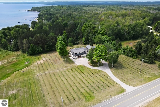 drone / aerial view featuring a rural view and a water view