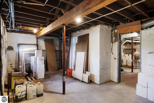 basement with white refrigerator