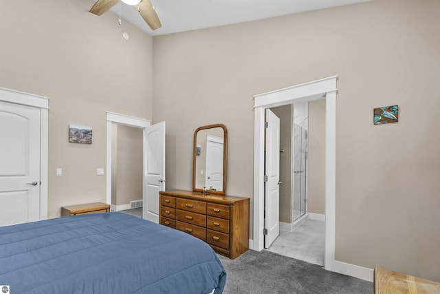 bedroom with ceiling fan, light carpet, connected bathroom, and high vaulted ceiling