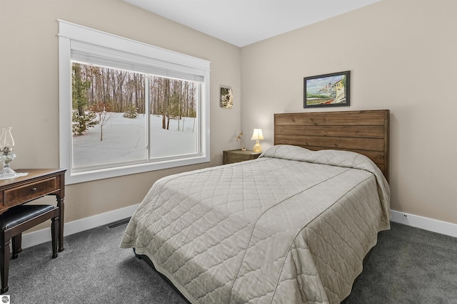 bedroom featuring dark colored carpet