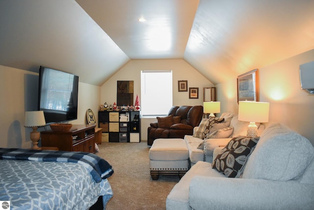 carpeted bedroom with lofted ceiling